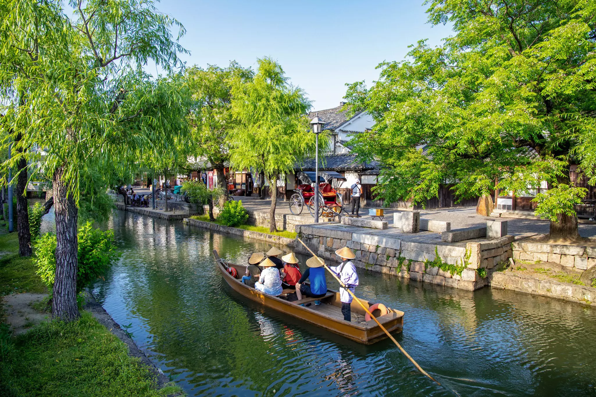Kurashiki is known for its pretty waterways and denim obsession. Sean3810 / Getty Images