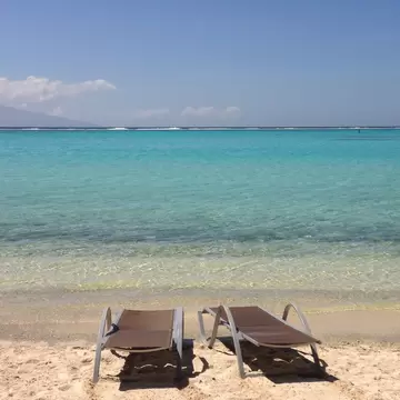 Two resort chairs on the beach by the lagoon in Temae Moorea, License Type: media, Download Time: 2025-05-29T18:46:07.000Z, User: lonelyplanetmedia, Editorial: false, purchase_order: 65050 - Digital Destinations and Articles, job: Global Publishing WIP, client: Global Publishing WIP, other: Peterson Haggarty // SS Comp Ingestion