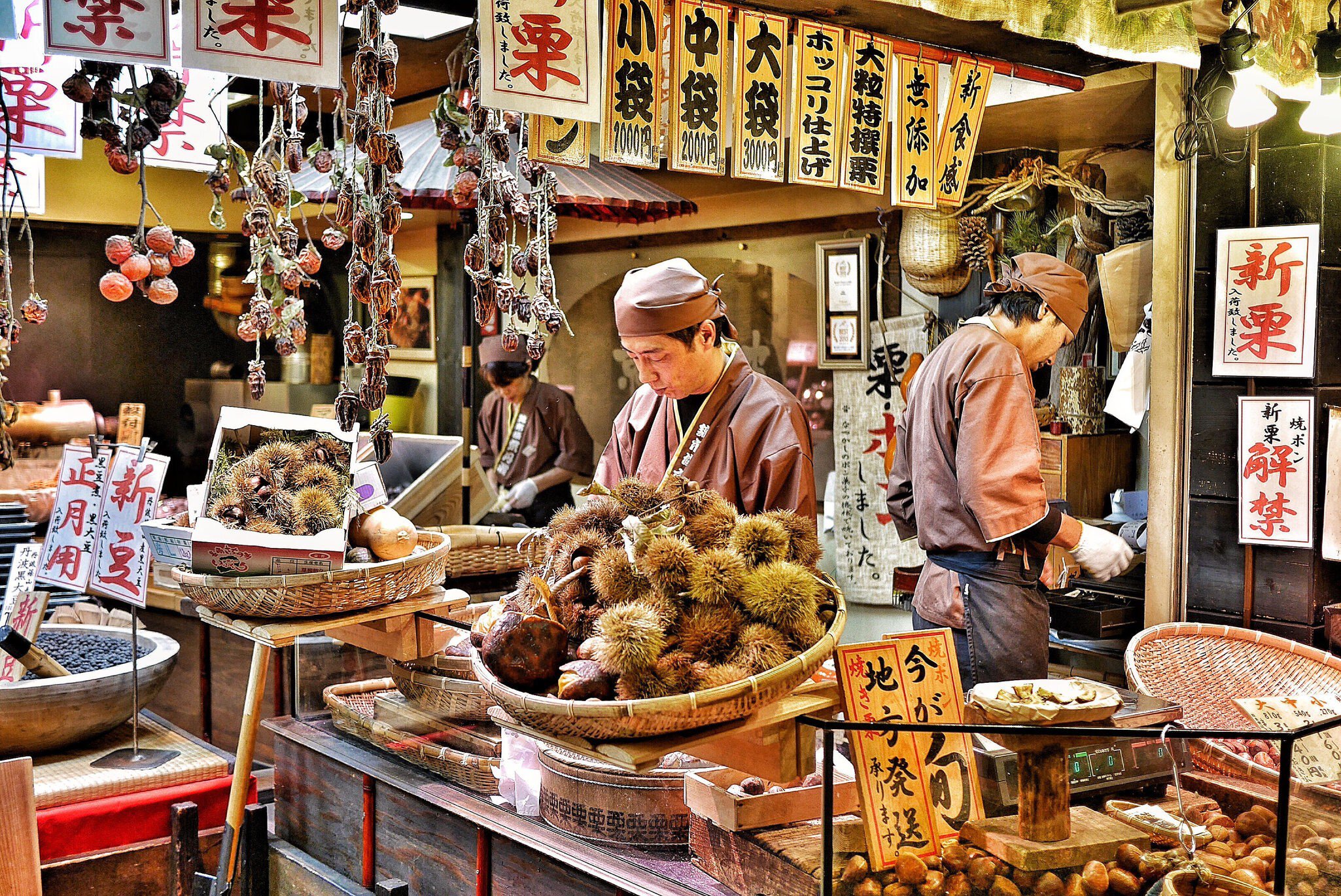 Vendors prepare chestnuts to sell at Nishiki Market in Kyoto, Japan on 22 November 2016.