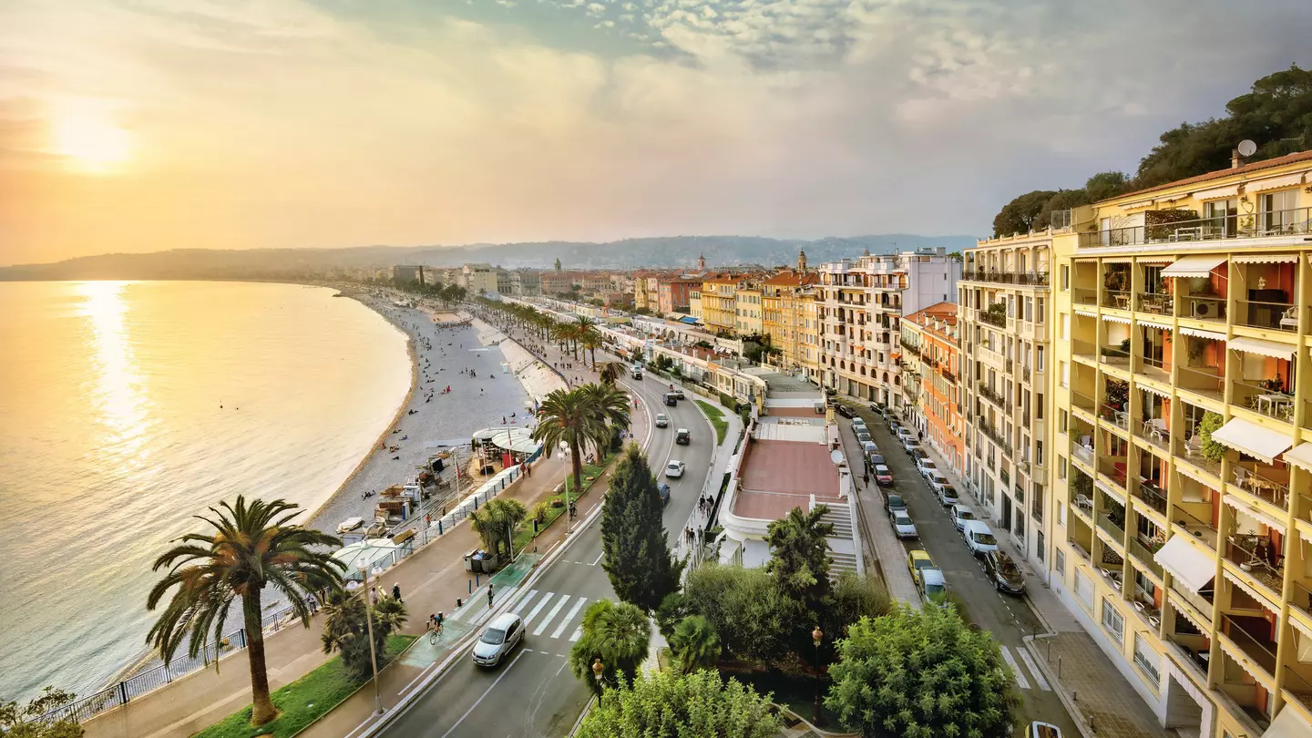 An overhead shot of the sunset over the Promenade des Anglais and Opéra Beach in Nice, Côte d’Azur, France