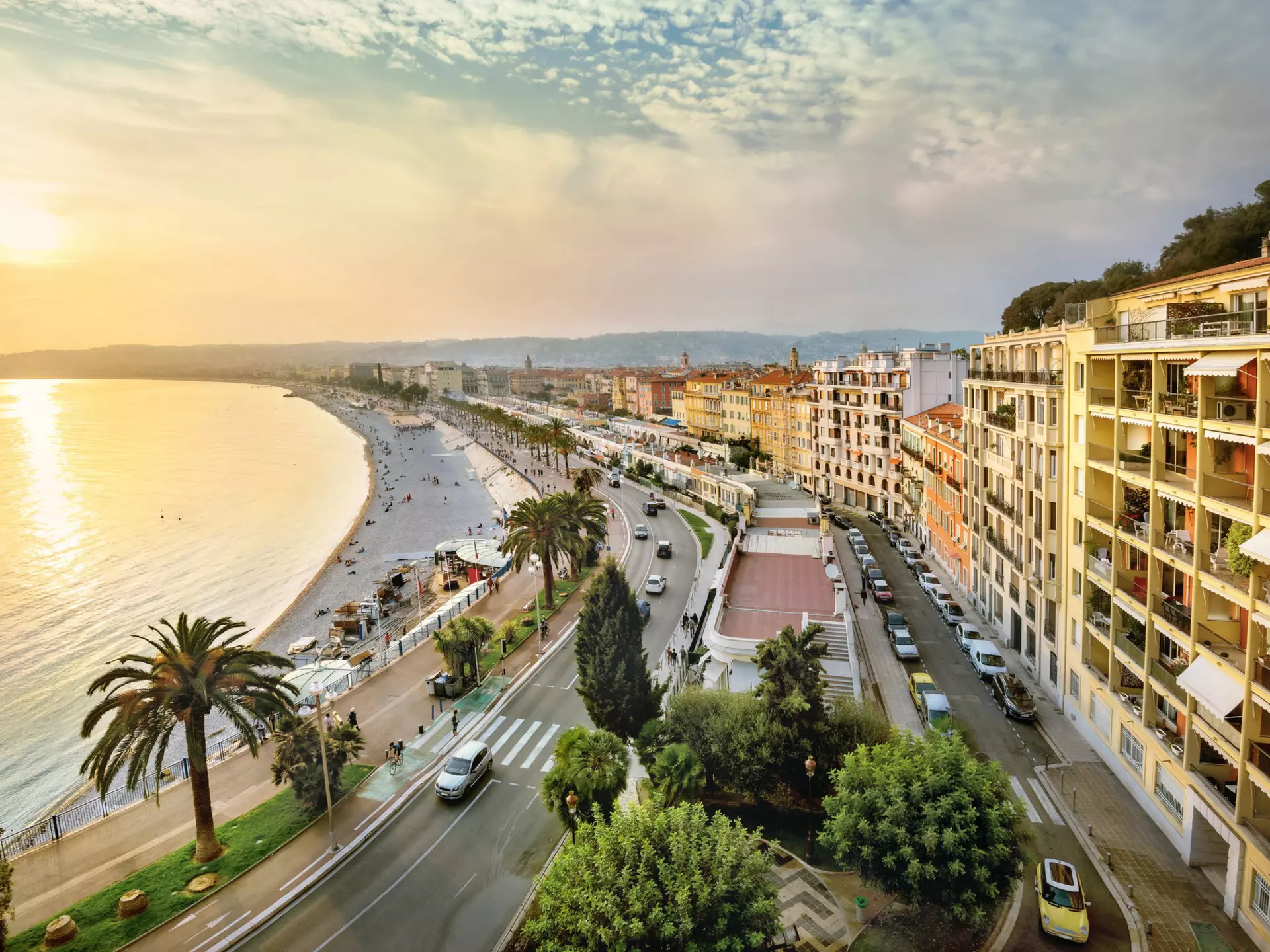 An overhead shot of the sunset over the Promenade des Anglais and Opéra Beach in Nice, Côte d’Azur, France