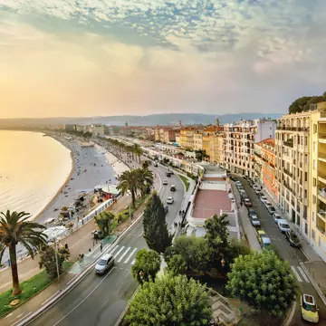 An overhead shot of the sunset over the Promenade des Anglais and Opéra Beach in Nice, Côte d’Azur, France