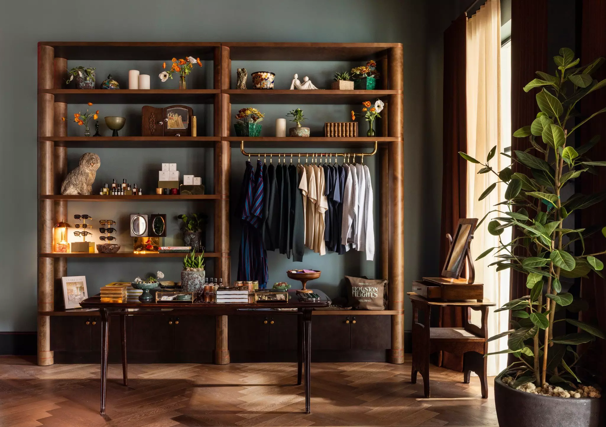 Wooden shelves filled with decor and a rod of clothing