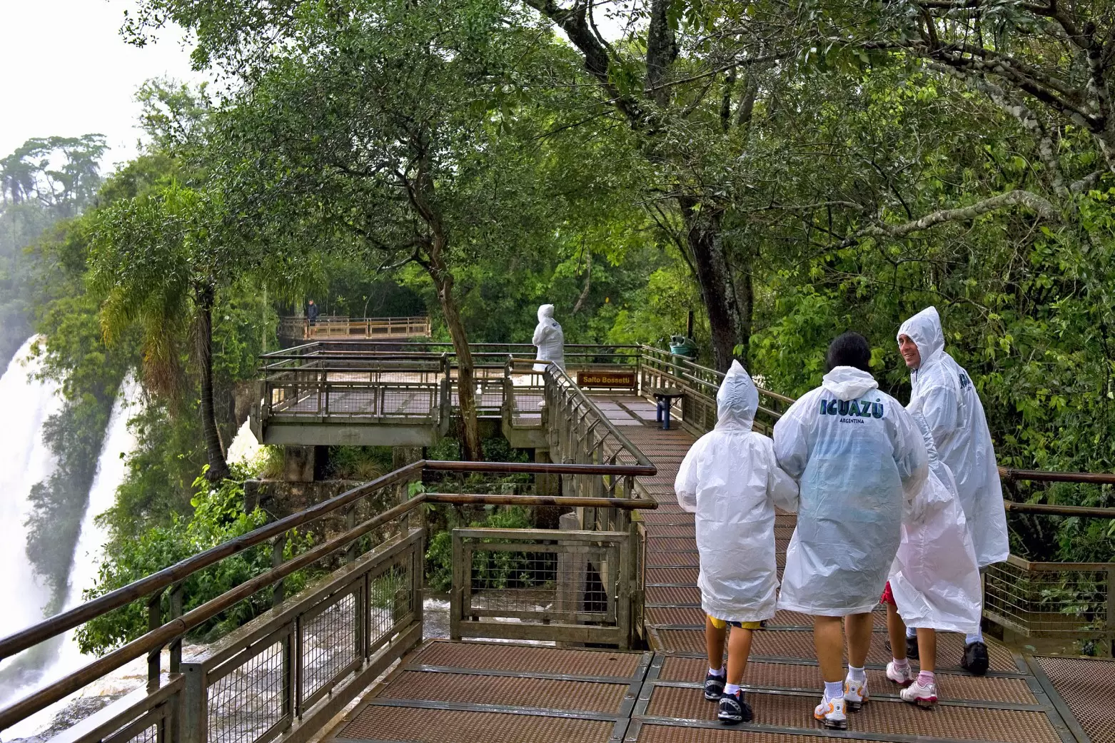 Visitors walking along the upper circuit of Iguazú Falls in Argentina.