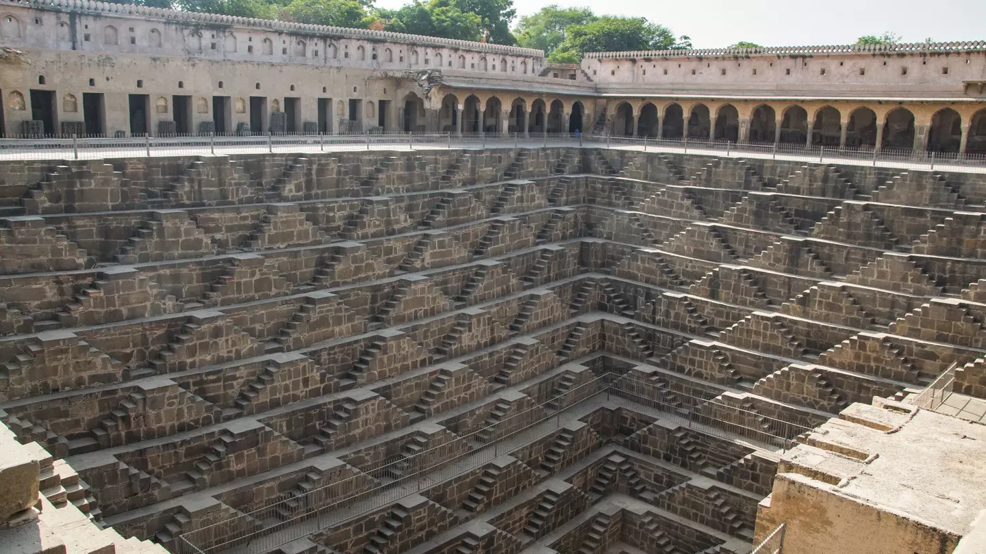 Chand Baori, a stepwell in the village of Abhaneri. Chand Baori consists of 3,500 narrow steps over 13 stories. It extends approximately 30 m (100 ft) into the ground.