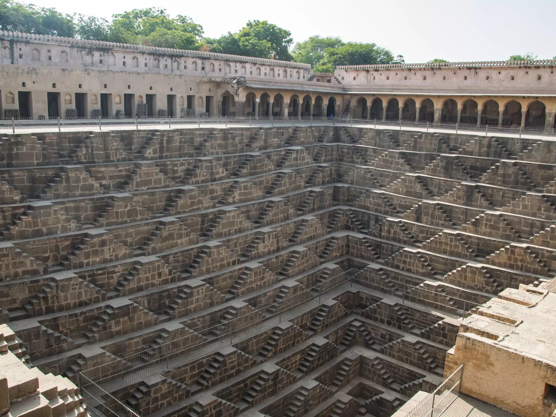 Chand Baori, a stepwell in the village of Abhaneri. Chand Baori consists of 3,500 narrow steps over 13 stories. It extends approximately 30 m (100 ft) into the ground.