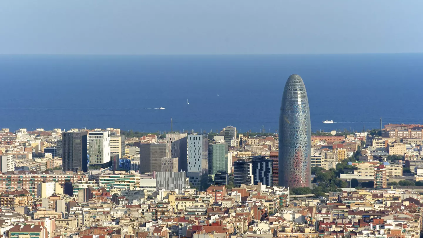 Looking over the skyline of Poblenou, with modern skyscrapers in the background and the blue Mediterranean beyond.