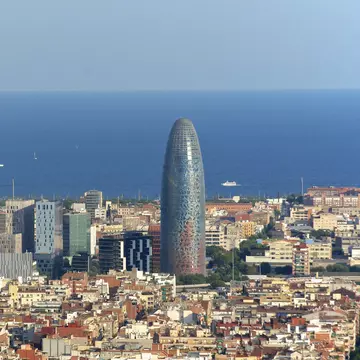 Looking over the skyline of Poblenou, with modern skyscrapers in the background and the blue Mediterranean beyond.