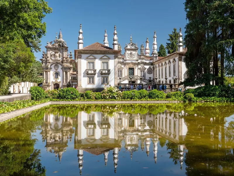 Reflection of villa in front of entrance of Mateus Palace in Vila Real, Portugal. 
