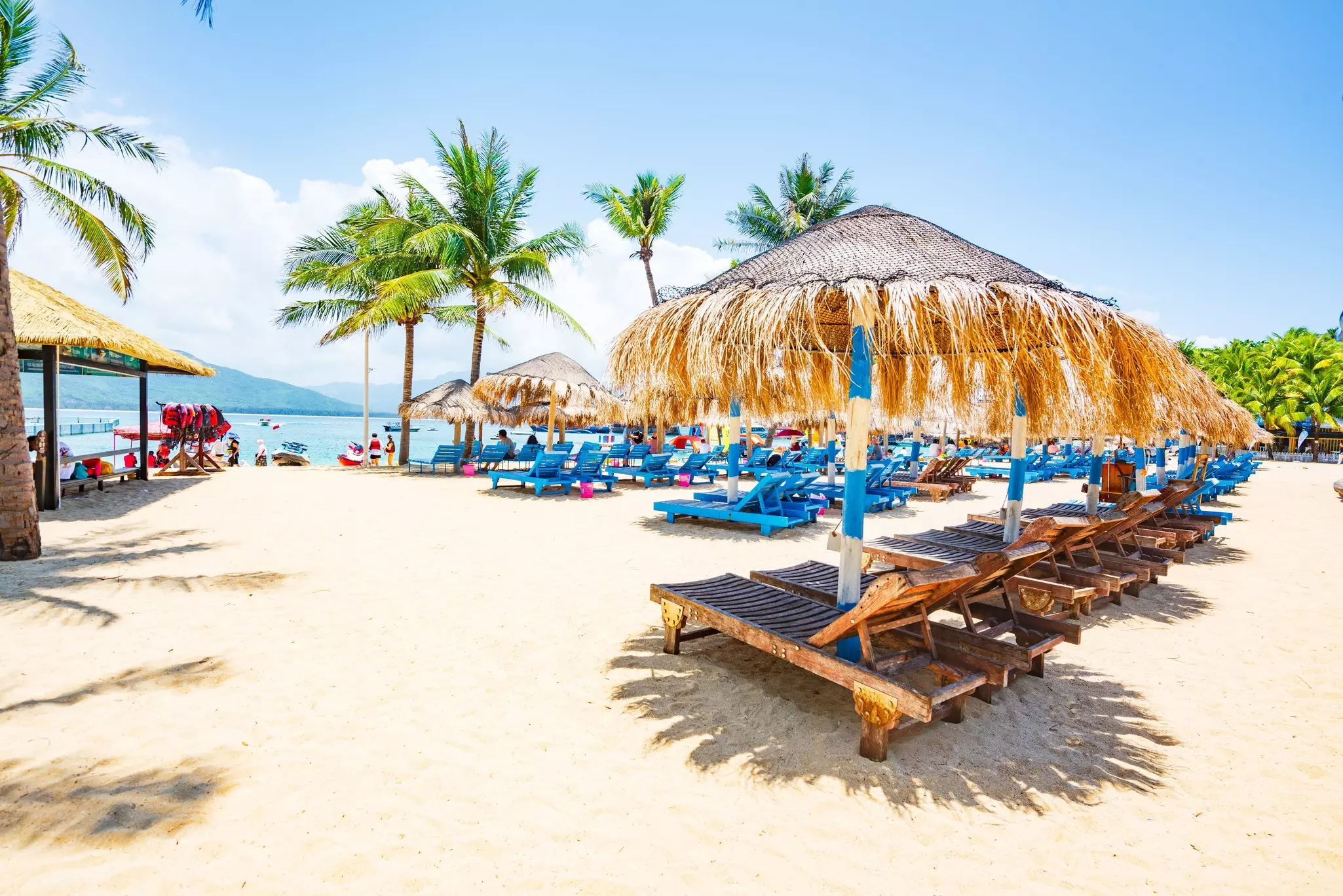 Beach loungers on Wuzhizhou Island near Sanya, Hainan, China. 