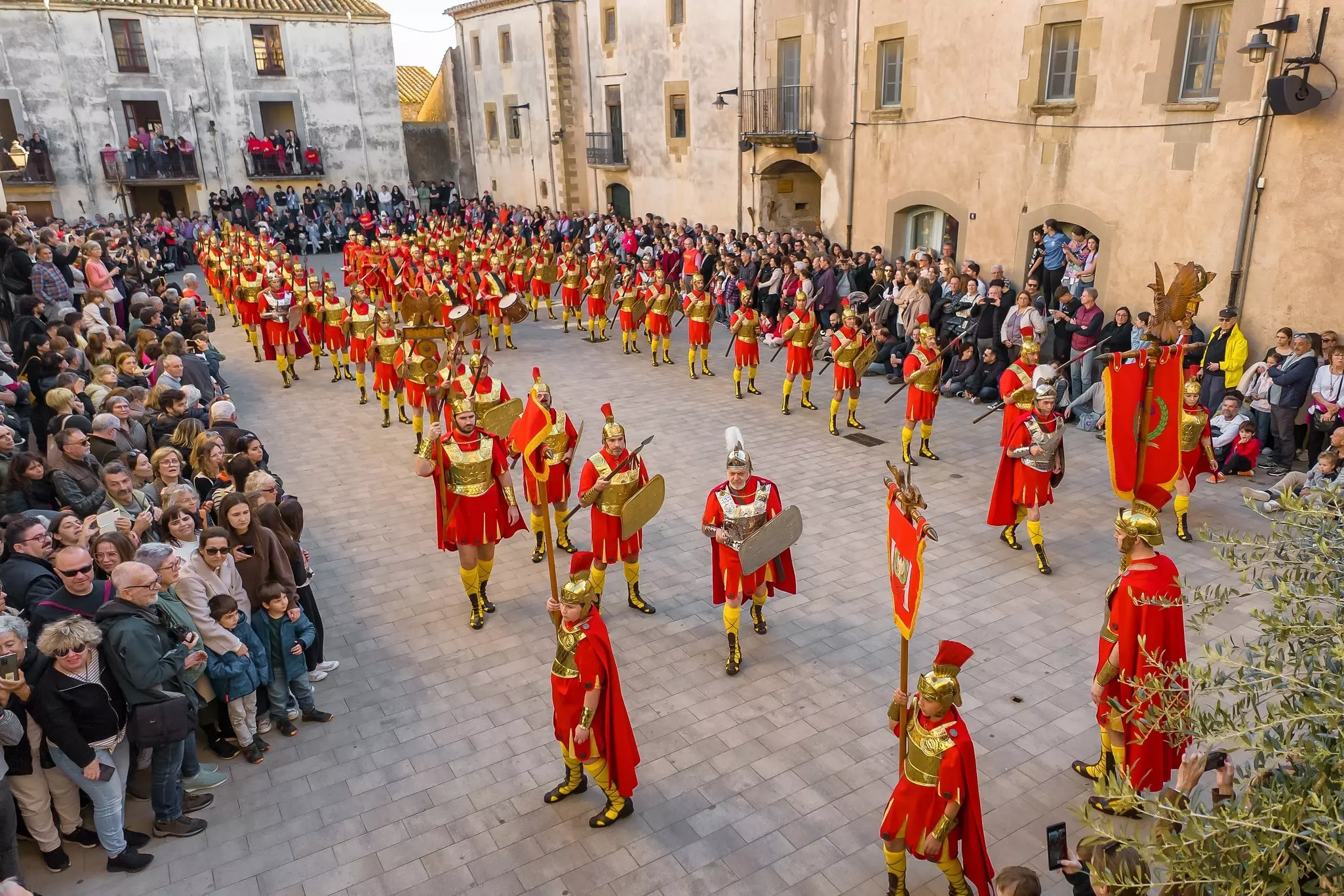 Parade during Holy Week, or Semana Santa, an annual celebration in Verges, Girona province, Catalonia, Spain. People in Roman soldiers costumes marching on the streets of Verges town 