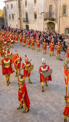 Parade during Holy Week, or Semana Santa, an annual celebration in Verges, Girona province, Catalonia, Spain. People in Roman soldiers costumes marching on the streets of Verges town 