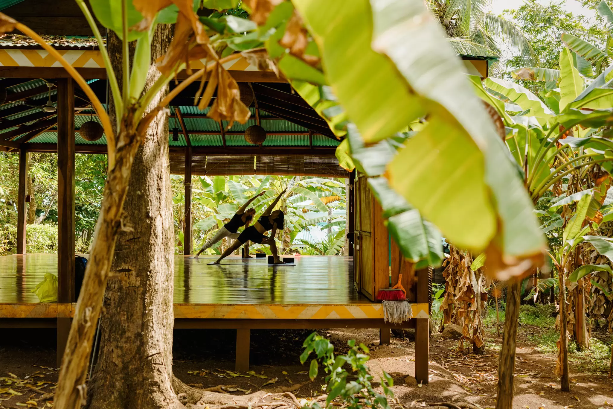 Women participate in a yoga class at a boutique hotel on Little Corn Island, Nicaragua. 