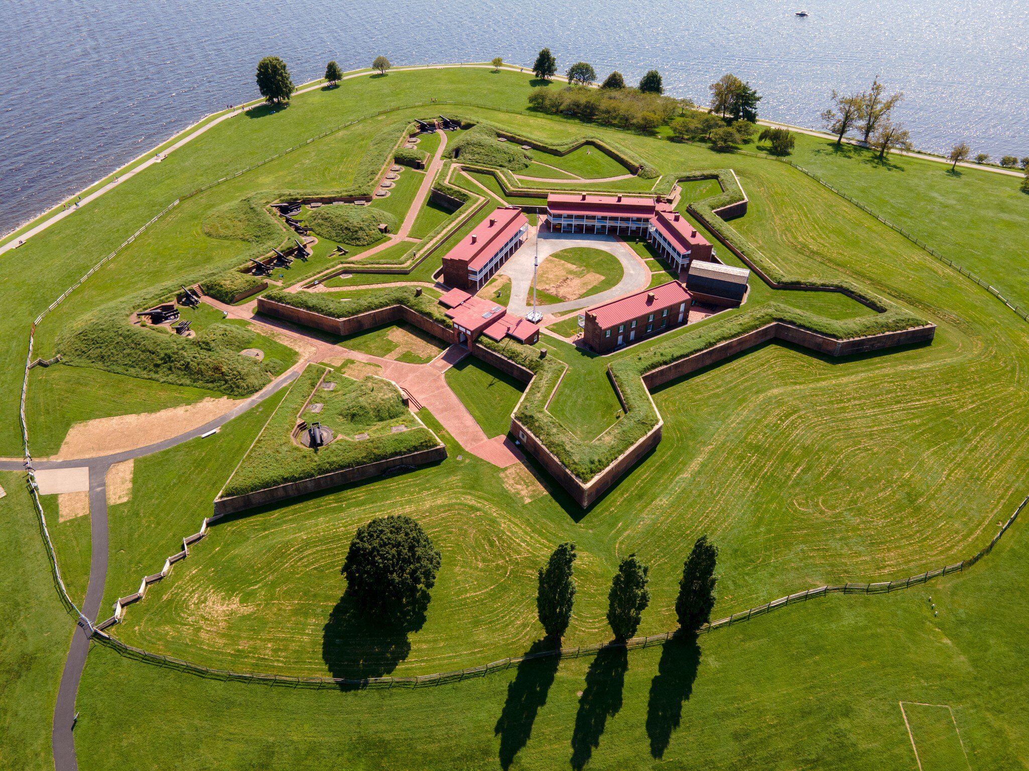 A star-shaped earthwork fort with green ramparts, seen from the air.