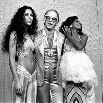 Cher, Elton John and Diana Ross at Rock Awards Santa Monica Civic Auditorium 1975; Photo Mark SullivanContour by Getty Images-16-9.jpg