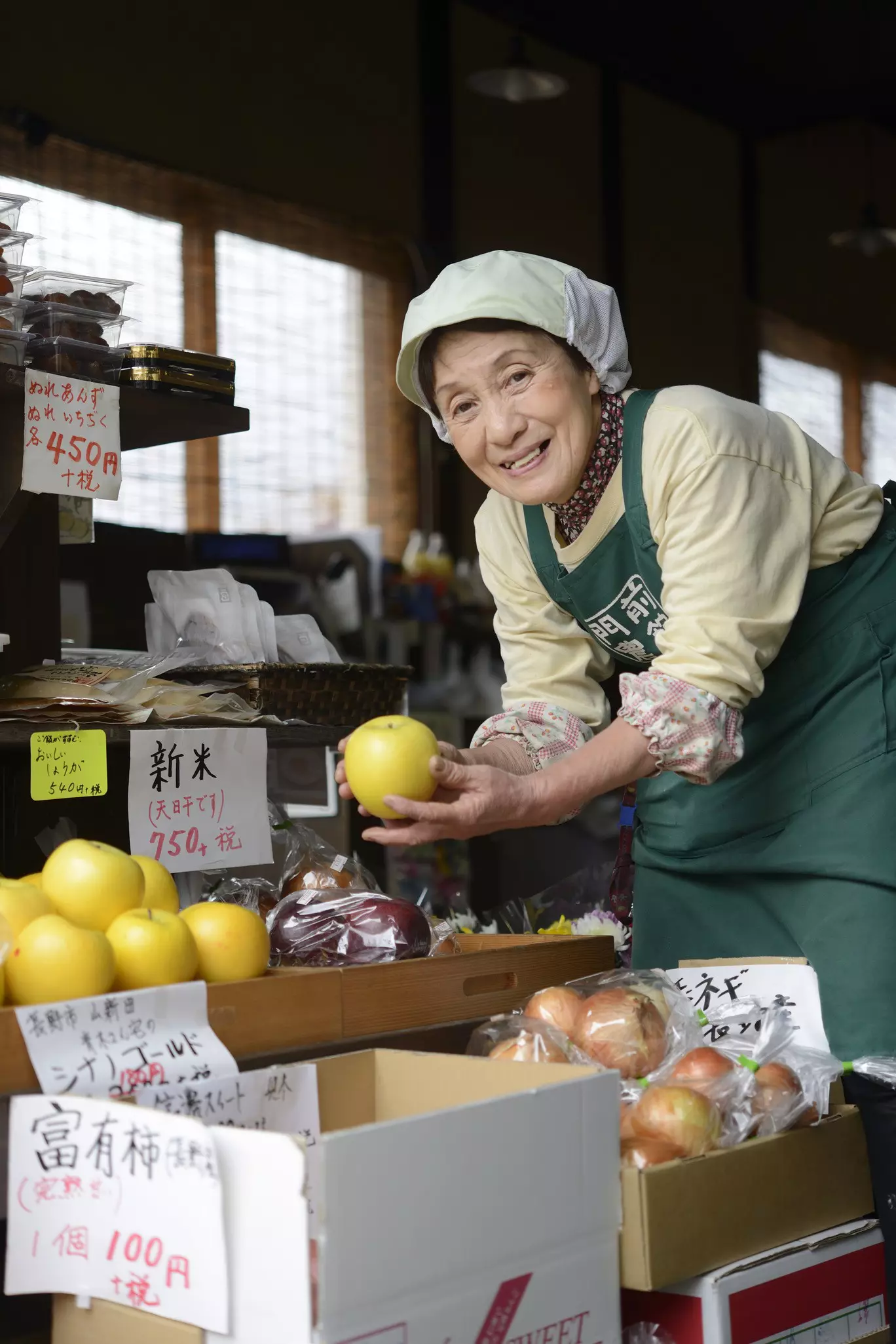 A conservationist pours feed into large black containers