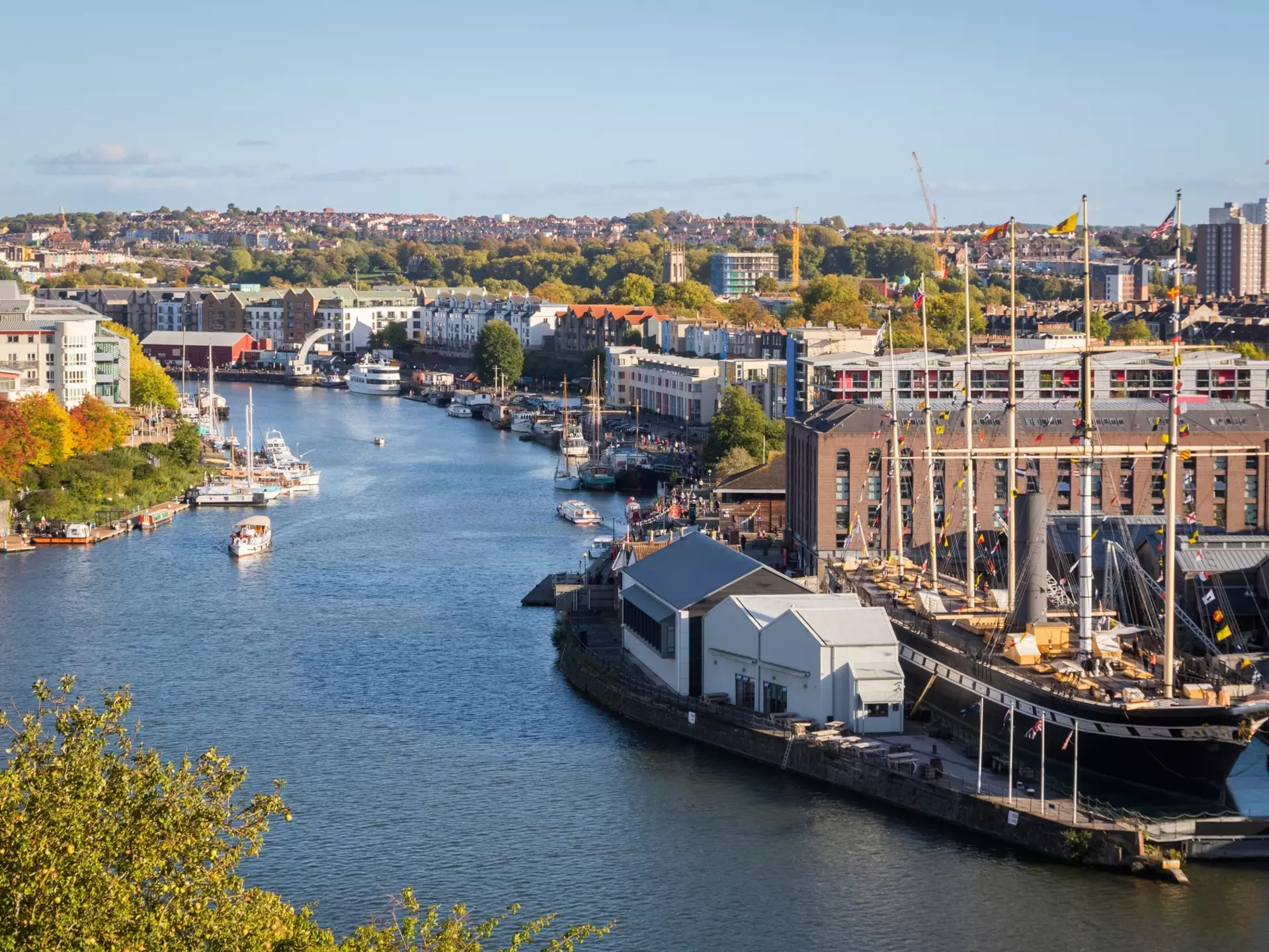 Bristol waterfront and cityscape in England, featuring Bristol Harbourside, Spike Island, Bristol Feeder Canal and Brunel's SS Great Britain. I Wei Huang/Shutterstock