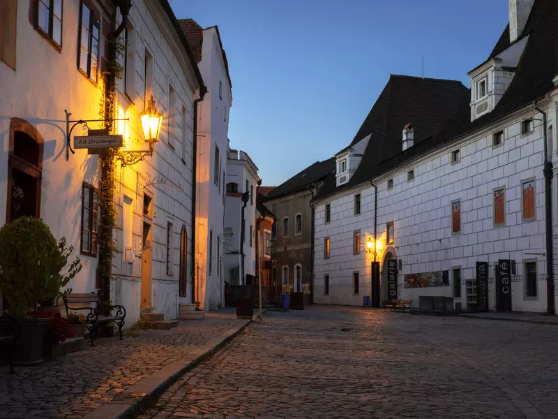 Cesky Krumlov, Czech Republic - September 29, 2018: Empty cobblestone street in the historic town of Cesky Krumlov during morning twilight. View of Egon Schiele Art Center. UNESCO World Heritage Site.  License Type: media  Download Time: 2023-08-06T11:35:34.000Z  User: hannahblackie10  Is Editorial: Yes  purchase_order:   