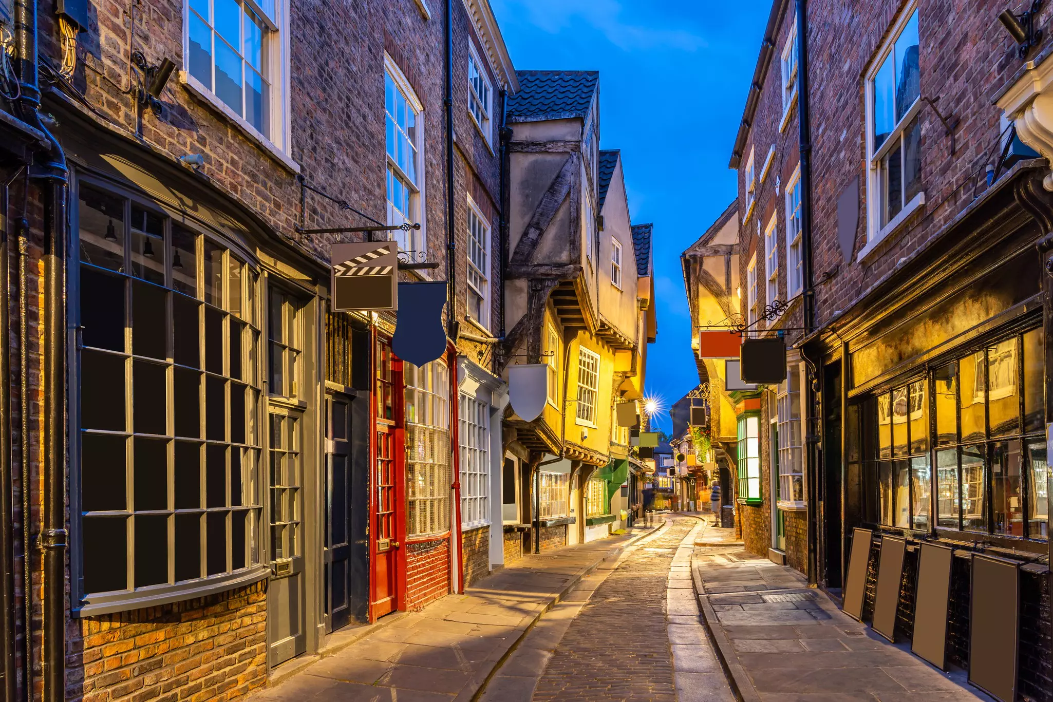A narrow street in the Shambles, York, during sunset. 