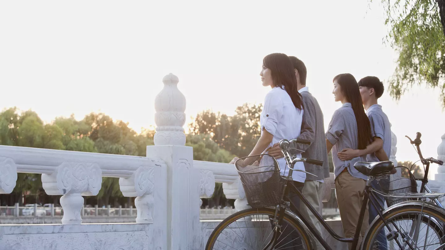 Two women on a tandem bike in Mexico City