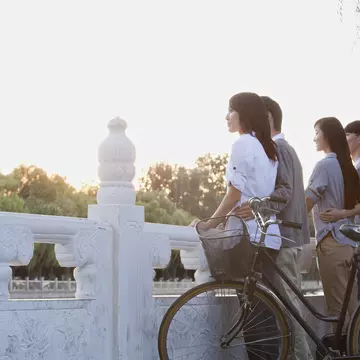 Two women on a tandem bike in Mexico City