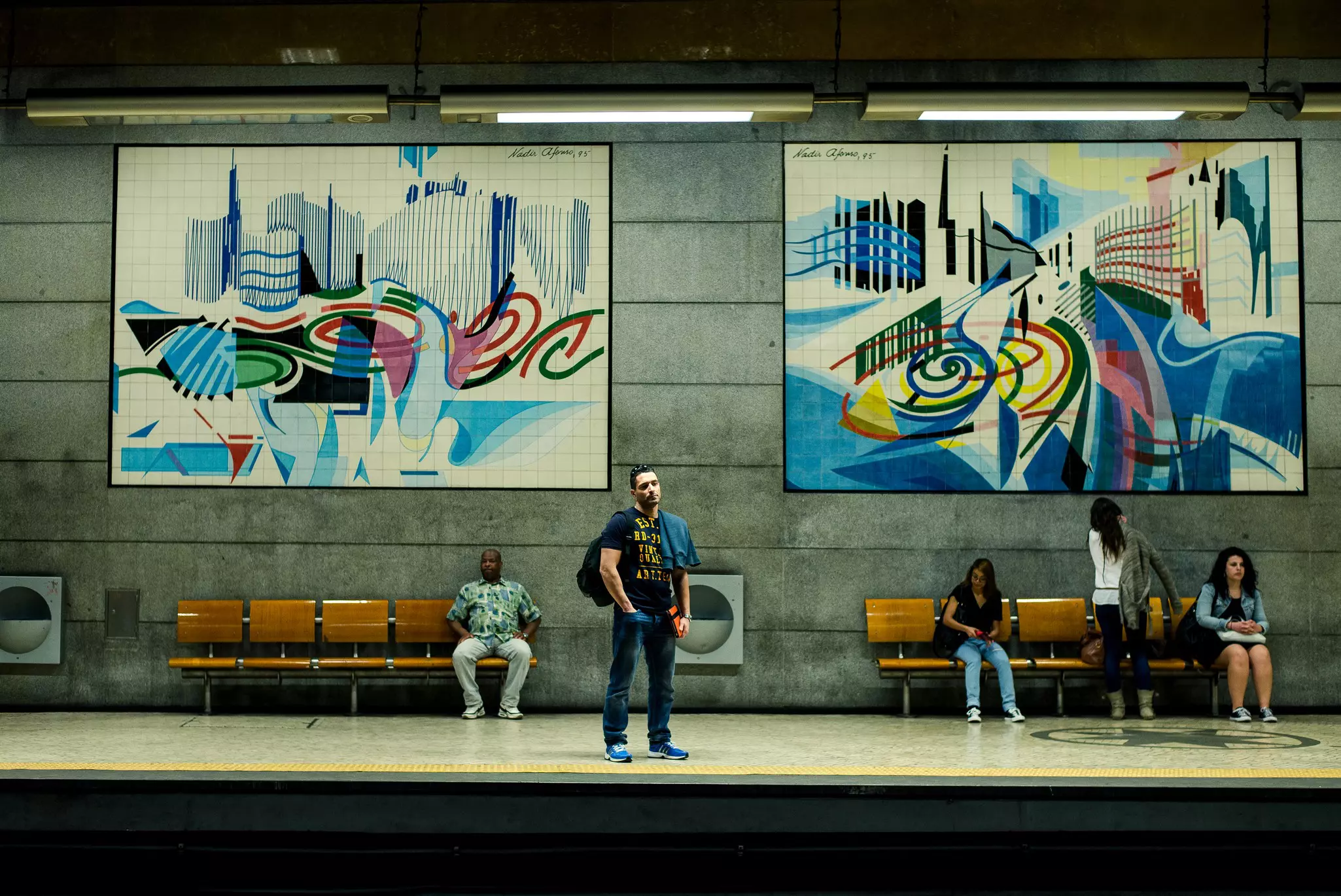 People waiting at an art-filled underground station in Lisbon
art, lisbon, middle, young, european, portugal, girl, people, painting, c