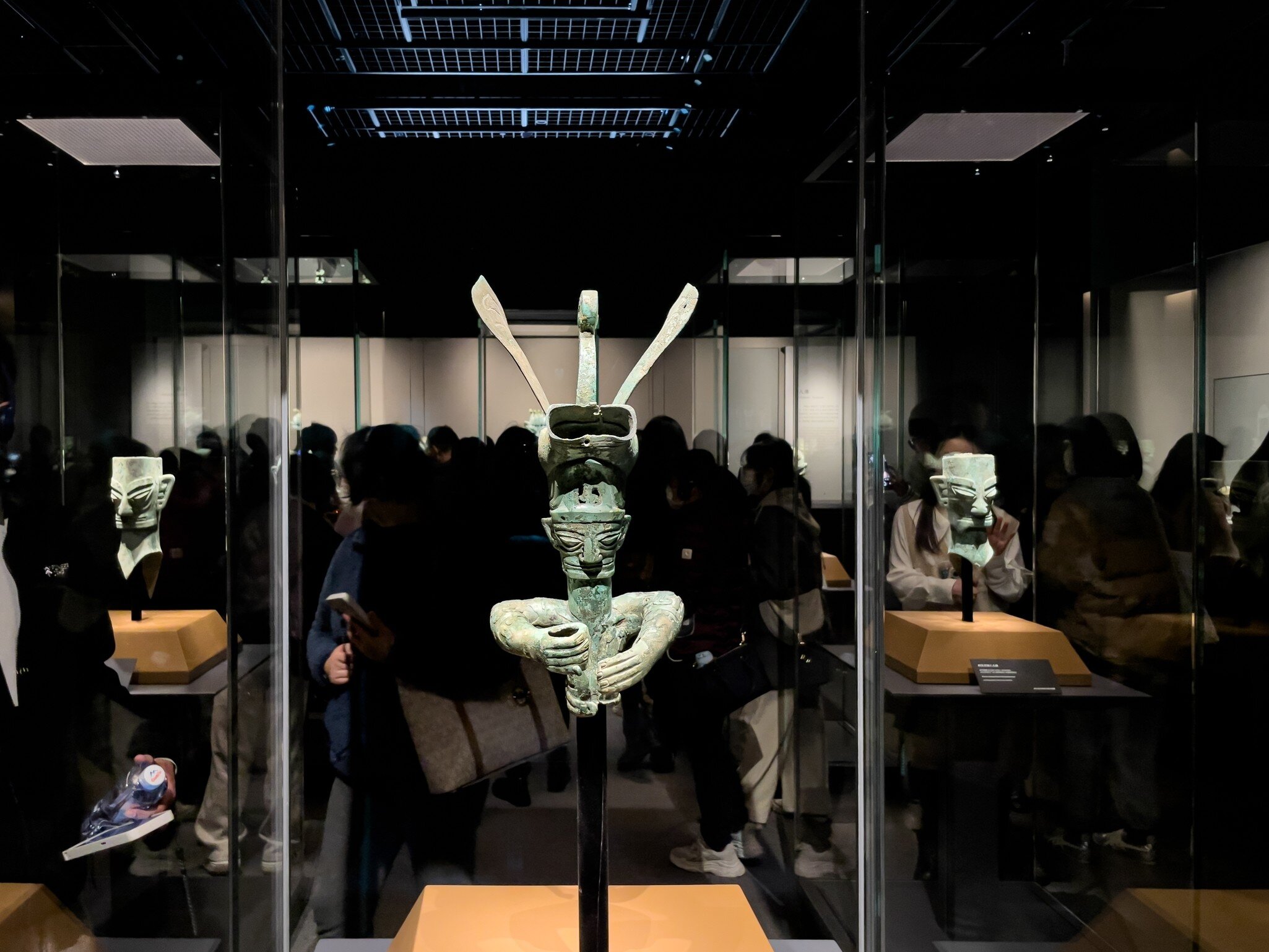 Shanghai, China - March 15th 2024: the mask and sculpture in Sanxingdui culture. it is is an archaeological site and a major Bronze Age culture in modern Guanghan, Sichuan. People are visiting, License Type: media, Download Time: 2026-08-26T14:46:47.000Z, User: LP_NZhan, Editorial: true, purchase_order: 65050 - Digital Destinations and Articles, job: App Content, client: Lonely Planet App, other: Nadine Zhan