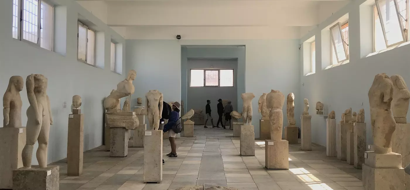 Marble statues fill a gallery
