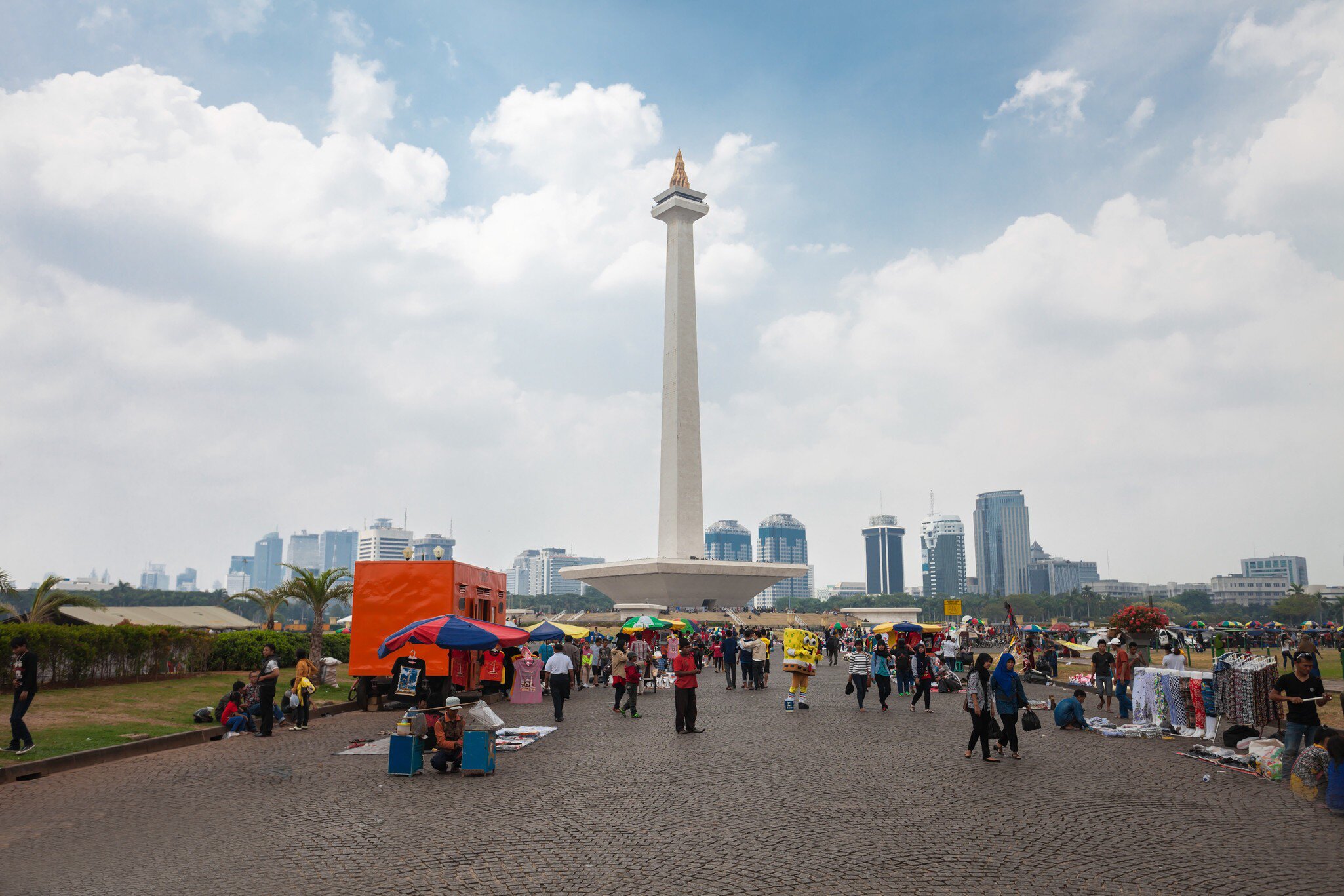OCTOBER 19, 2014: People surround the National Monument in the centre of Merdeka Square.
303220931
skyscraper, jakarta, tower, square, park, national, travel, day, statue, central, urban, landmark, history, indonesia, asia, building, flame, obelisk, place, architecture, gold, city, independence, sky, tourism, java, monument, asian, museum, capital, cityscape, nasional, monas, monumen, merdeka, batavia