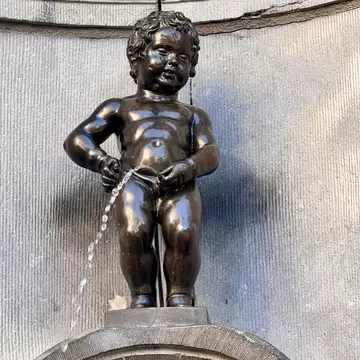 Brussels, Belgium - Mar 9, 2025: Manneken Pis (Little Pissing Man) is a landmark bronze fountain sculpture in central Brussels, Belgium., License Type: media, Download Time: 2026-04-24T13:56:22.000Z, User: LP_NZhan, Editorial: true, purchase_order: 65050 - Digital Destinations and Articles, job: App content, client: Lonely Planet App, other: Nadine Zhan