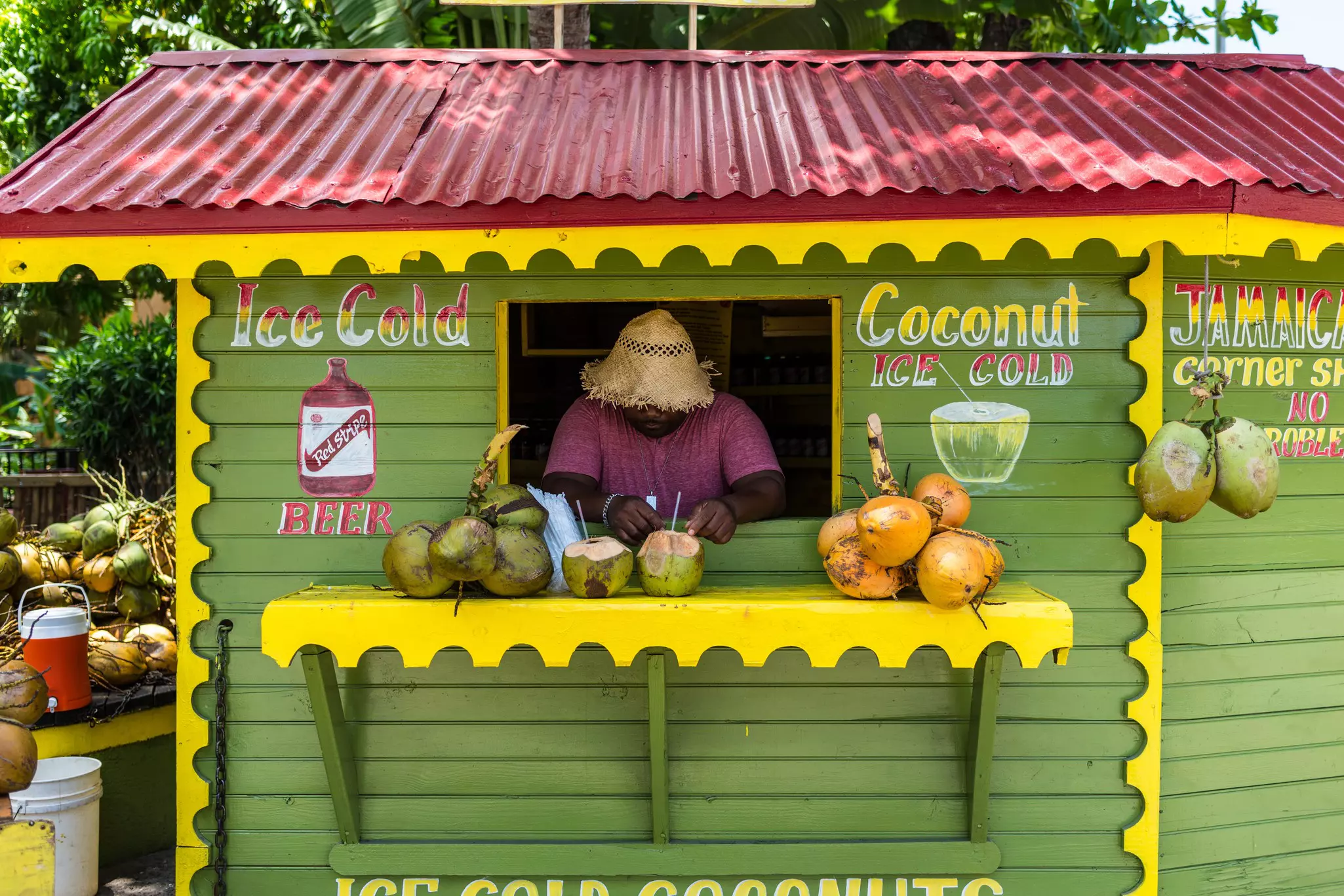 Ice Cold Coconut Fruit Drink with Rum stall/corner shop at the Ocho Rios Cruise Ship Port in the streets of Ocho Rio
