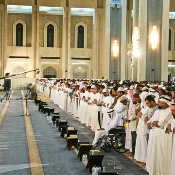 Ramadan prayer at Grand Mosque of Kuwait at night , Kuwait City, Kuwait.