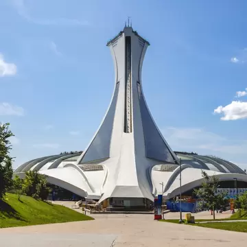 Iconic stadium in Montreal with modern architecture and clear sky., License Type: media, Download Time: 2026-09-15T15:27:37.000Z, User: LP_NZhan, Editorial: false, purchase_order: 65050 - Digital Destinations and Articles, job: App Content, client: Lonely Planet App, other: Nadine Zhan 