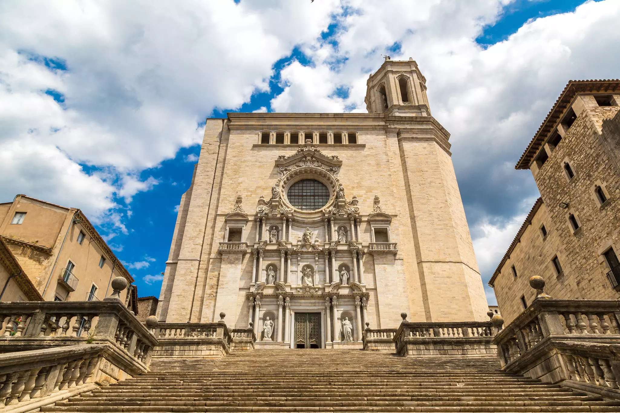 Girona cathedral facade with statues in a beautiful summer day, Catalonia, Spain.