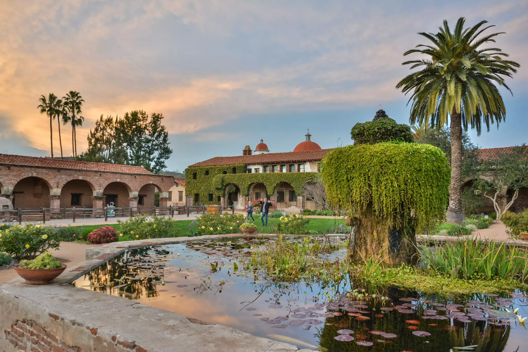 The courtyard of Mission San Juan Capistrano is beautiful at dusk © Alizada Studios / Shutterstock