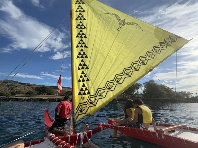 Guests on a Hawaiian canoe in the morning