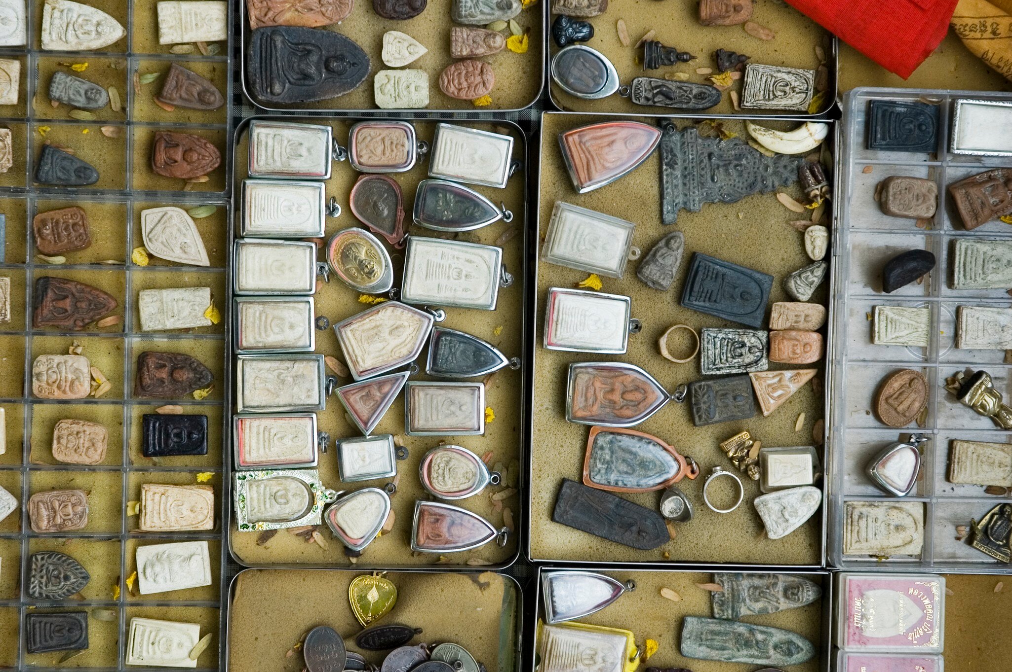 A display of amulets in open boxes at Amulet Market