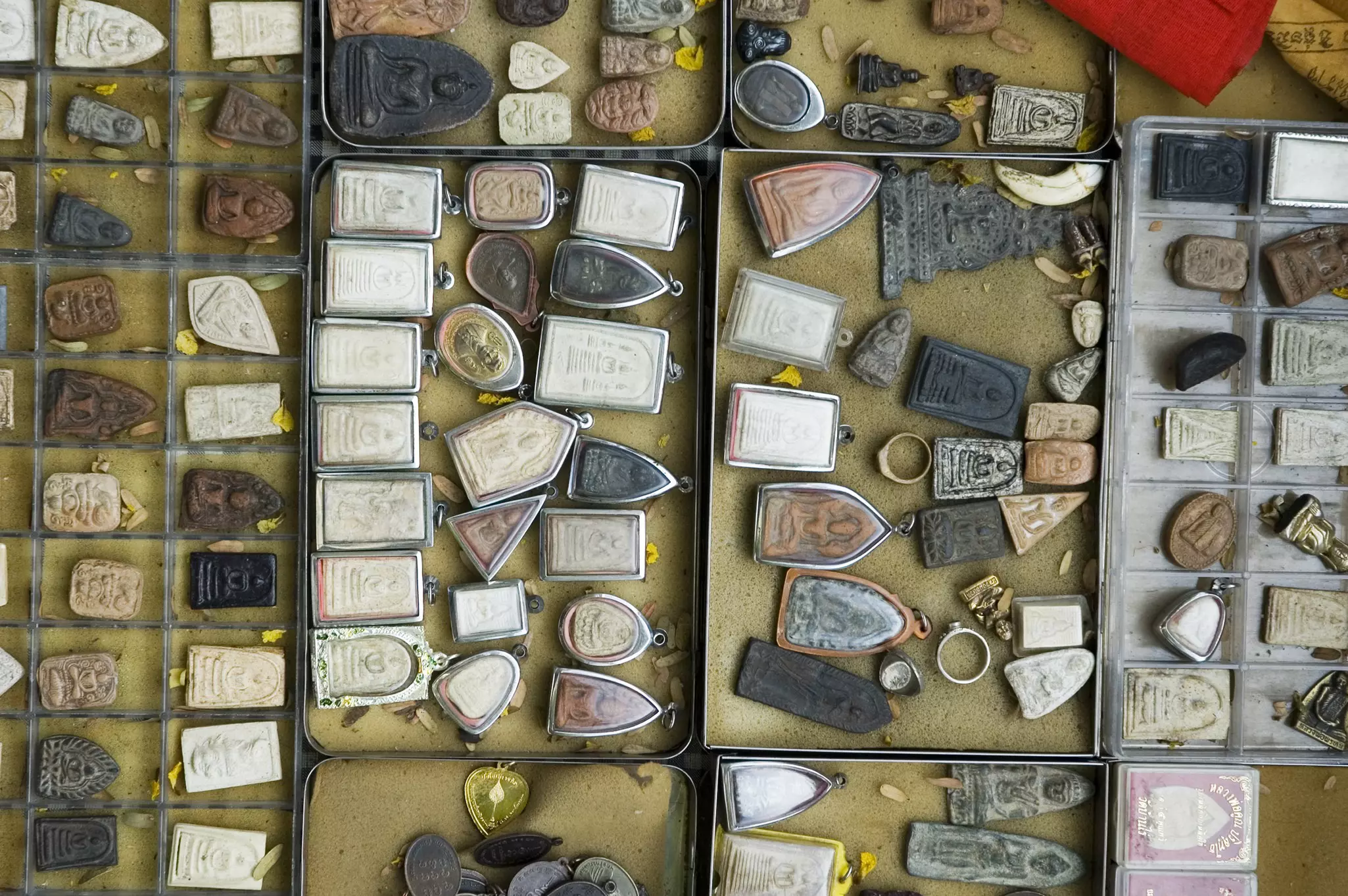 A display of amulets in open boxes at Amulet Market