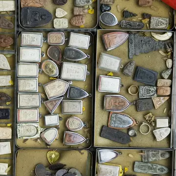 A display of amulets in open boxes at Amulet Market