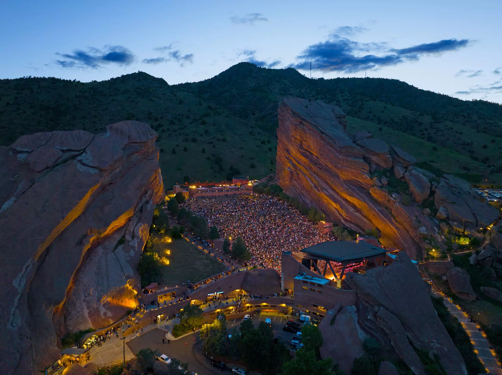 Crowds fill Red Rocks Amphitheatre at sunset, Colorado, USA.