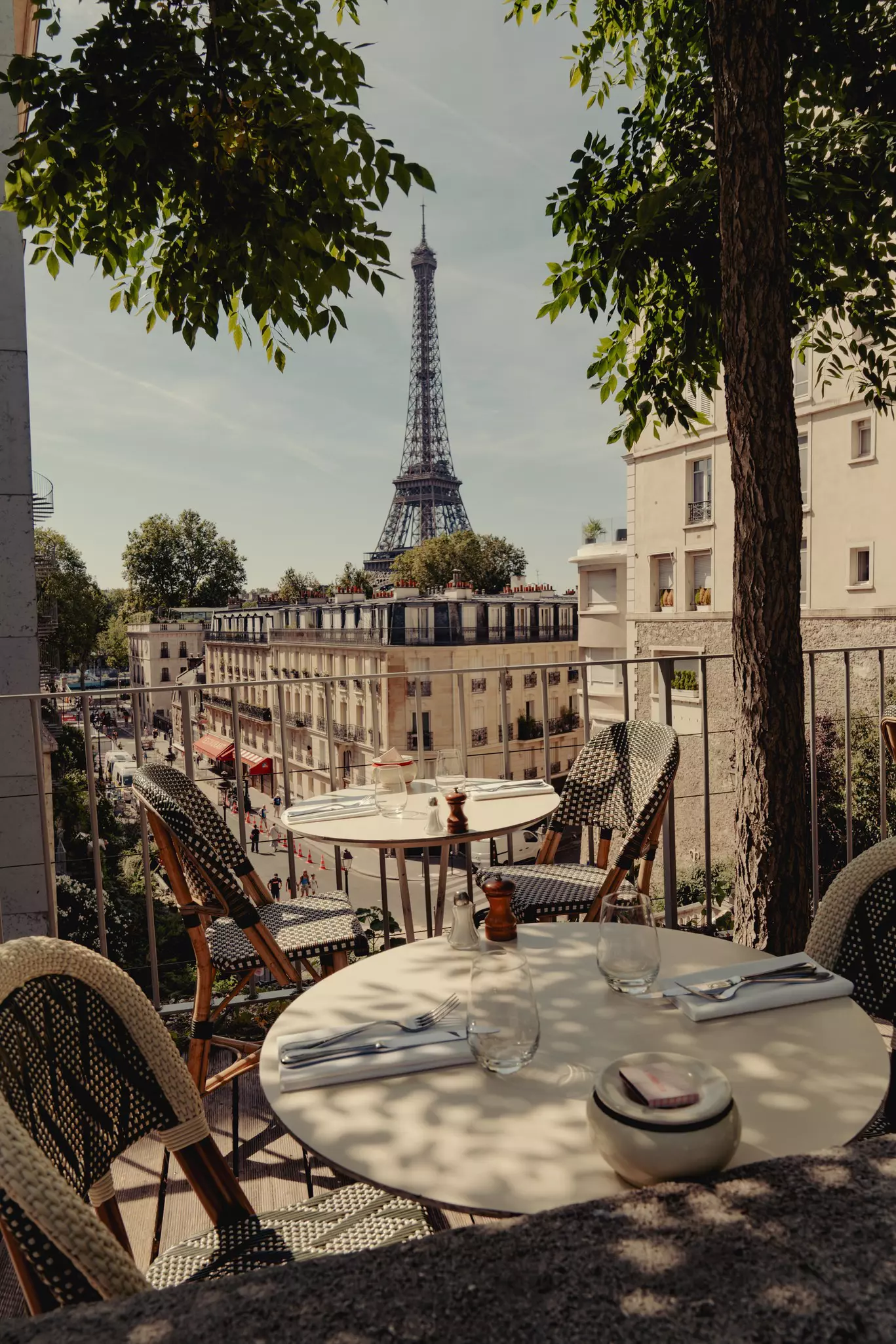 View of the iconic iron Eiffel Tower from a restaurant patio