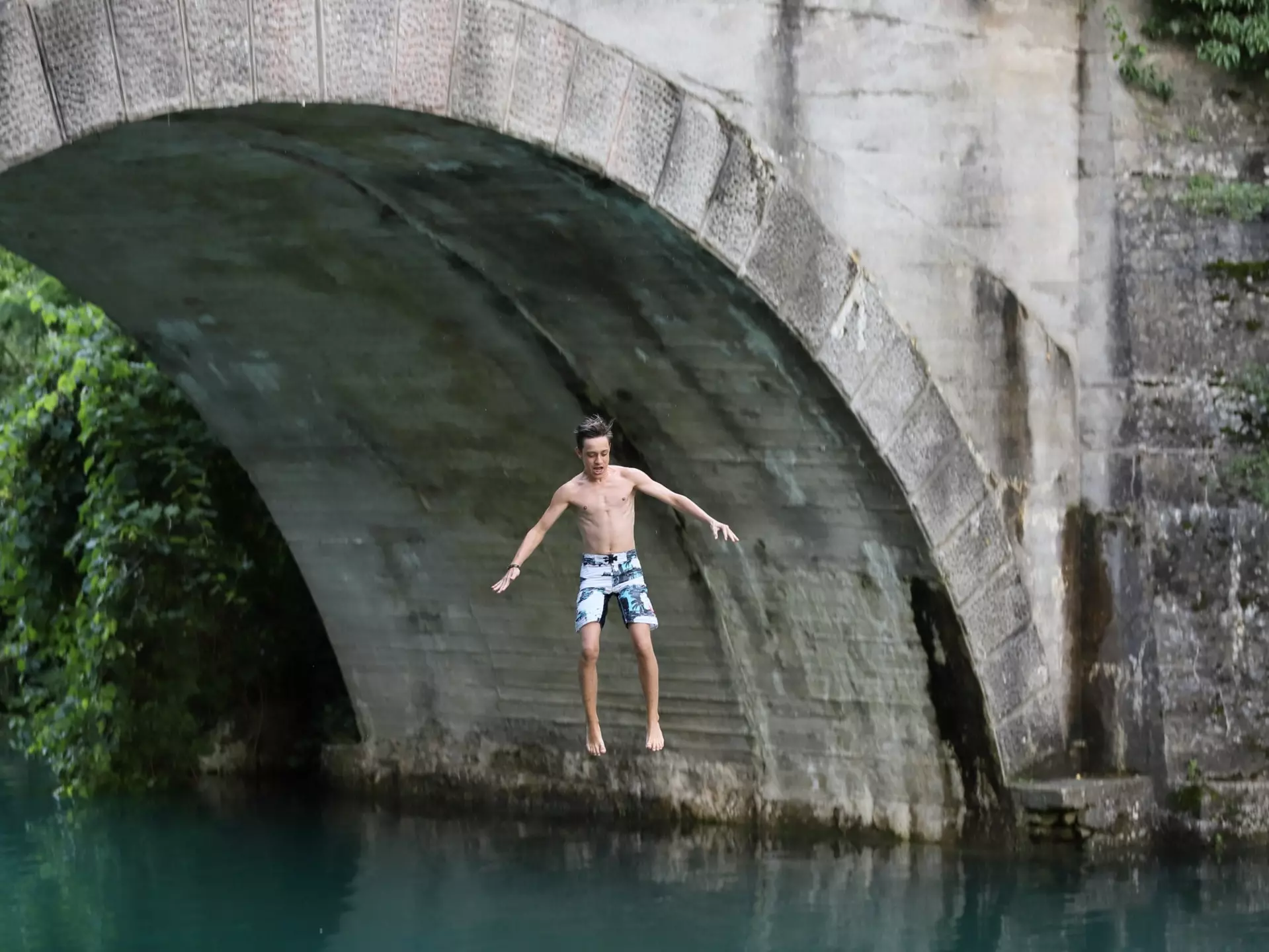 Slovenia’s plentiful outdoor activities (such as jumping into the Soča River) will delight even the most jaded teenager © MarkoM / Getty Images