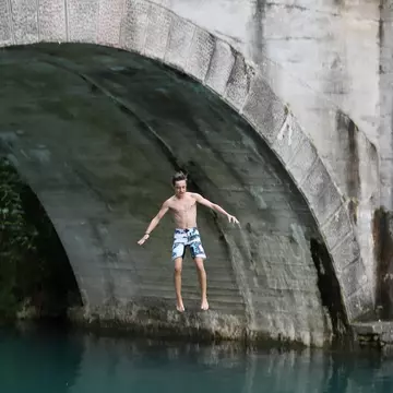 Slovenia’s plentiful outdoor activities (such as jumping into the Soča River) will delight even the most jaded teenager © MarkoM / Getty Images