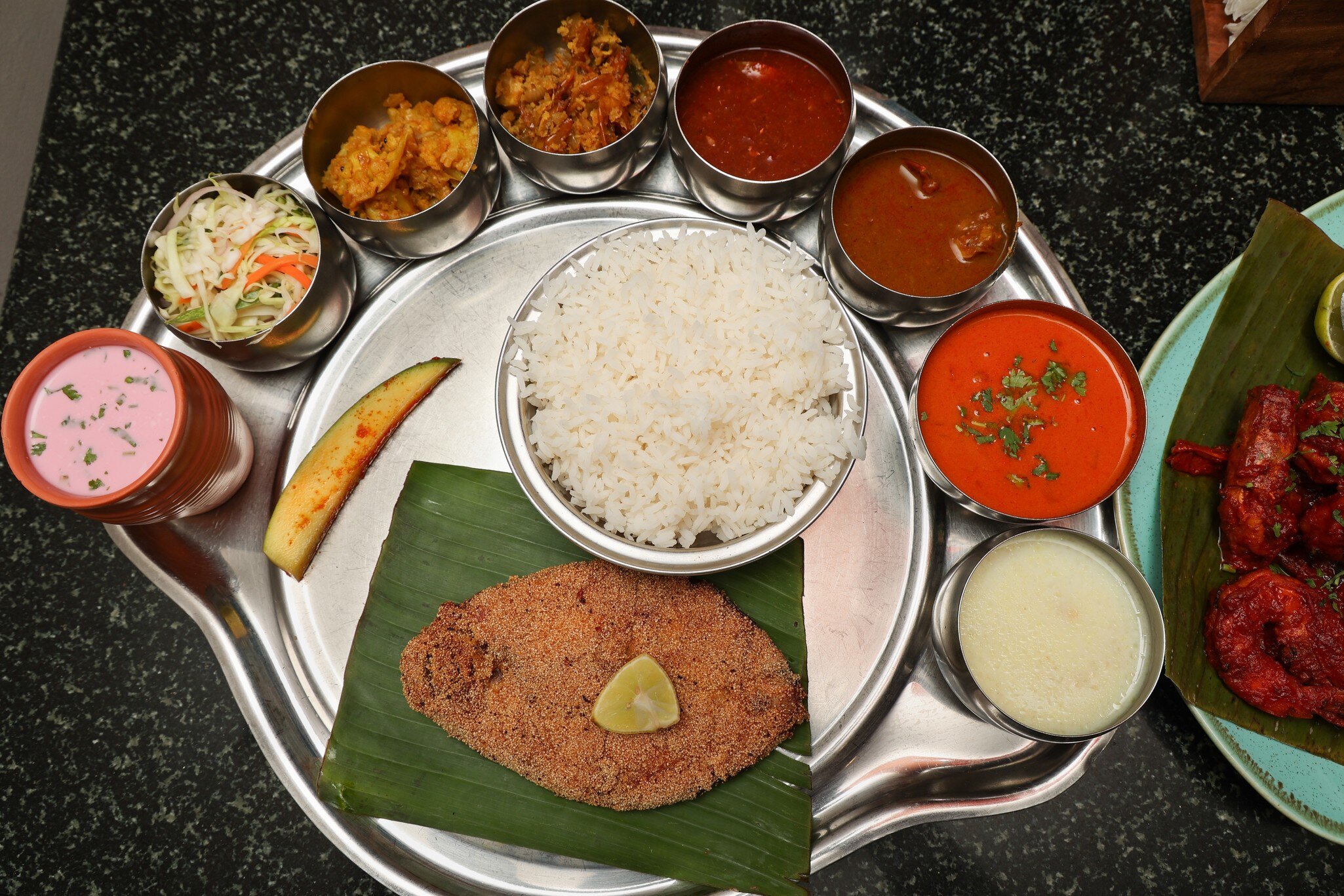 Goan Fish Thali served with rawa fried seer fish, Sol Kadi Solkadhi Kokum curry, and rice. Mumbai, India.
