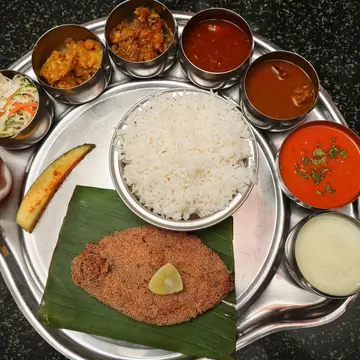 Goan Fish Thali served with rawa fried seer fish, Sol Kadi Solkadhi Kokum curry, and rice. Mumbai, India.