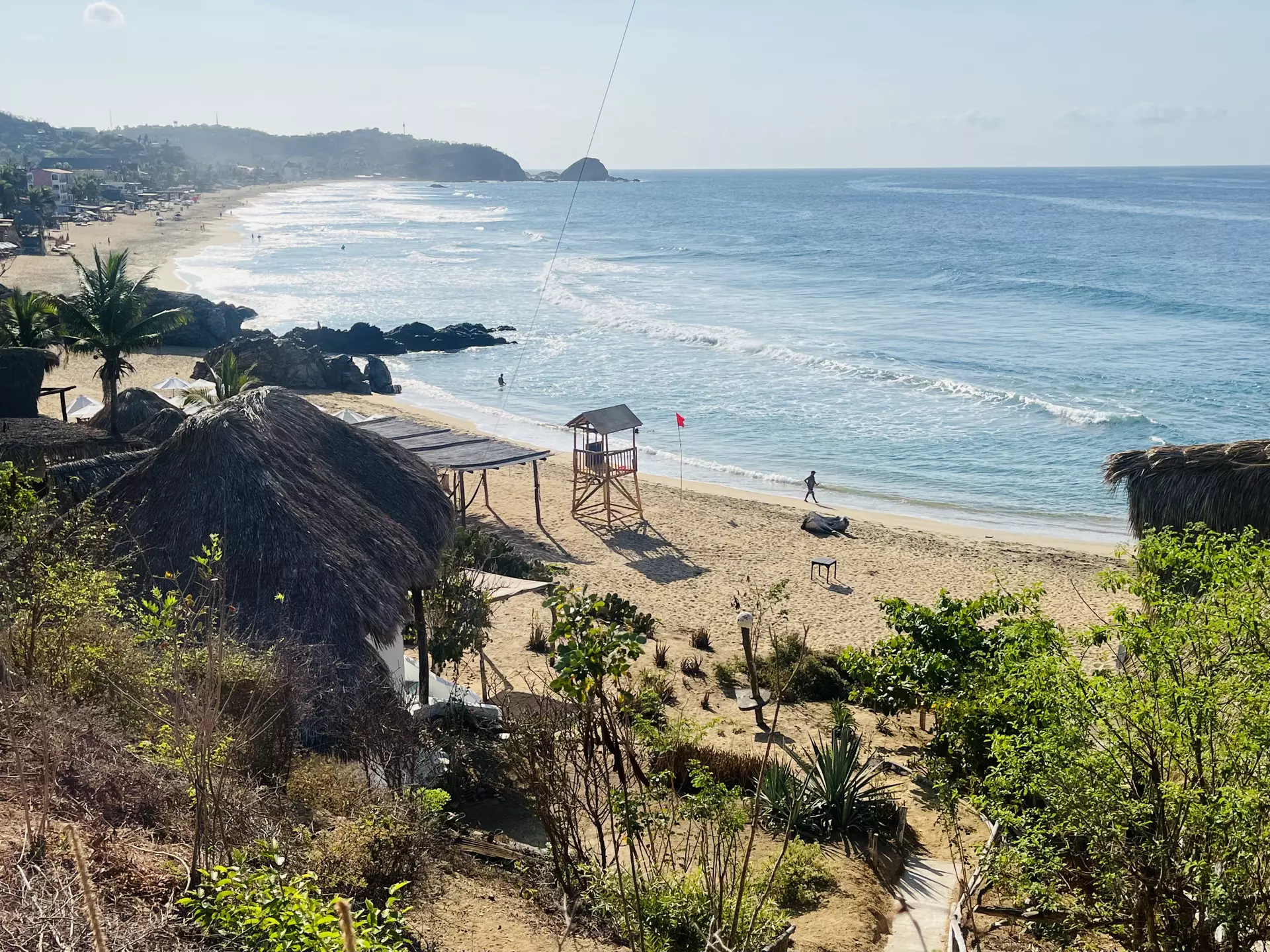 A gorgeous, peaceful sandy beach lapped by waves.