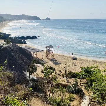 A gorgeous, peaceful sandy beach lapped by waves.