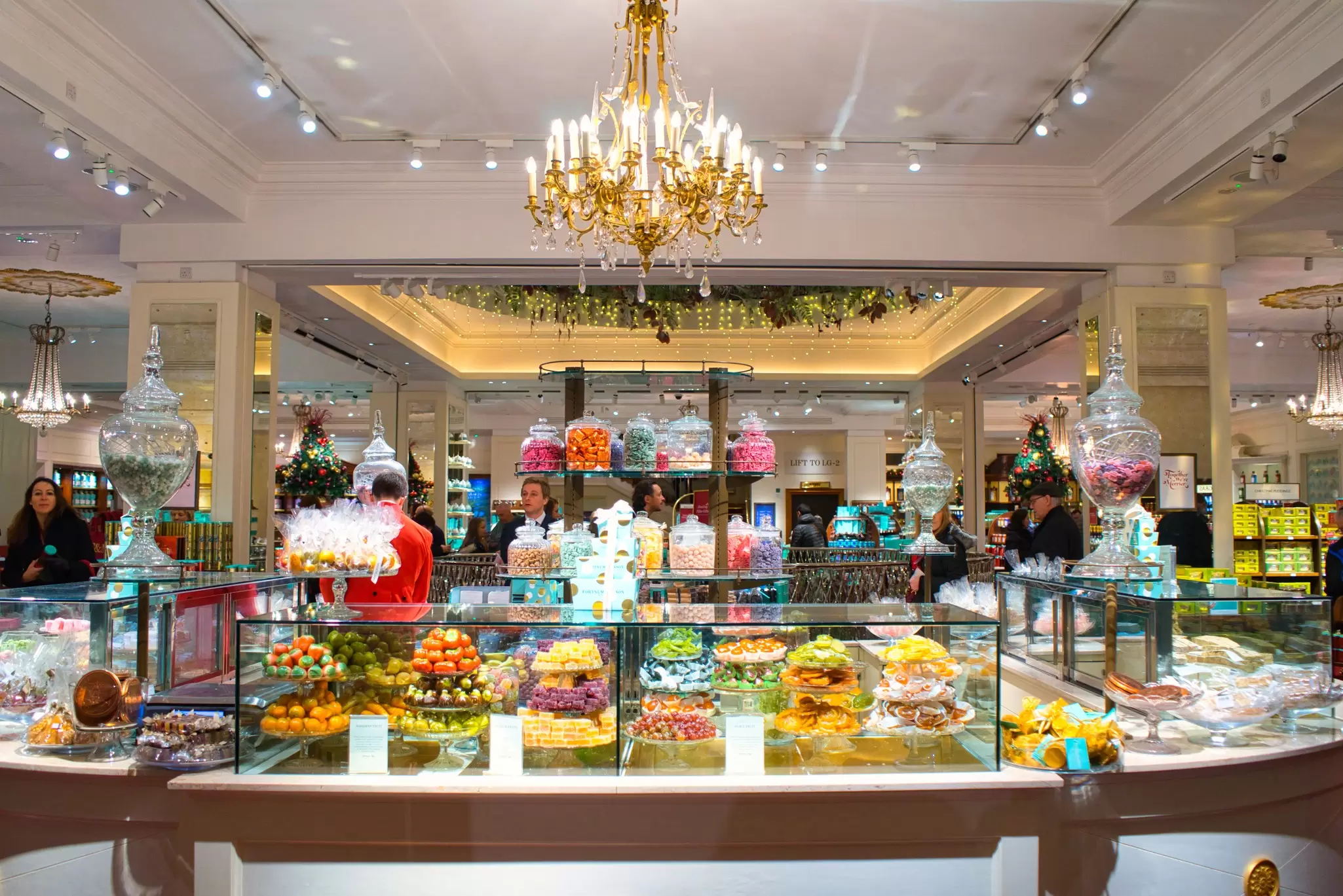 The salesman in red frock-coat in the legendary huge sweets shop  Fortnum & Mason. The shop is established in 1707 by William Fortnum and Hugh Mason 