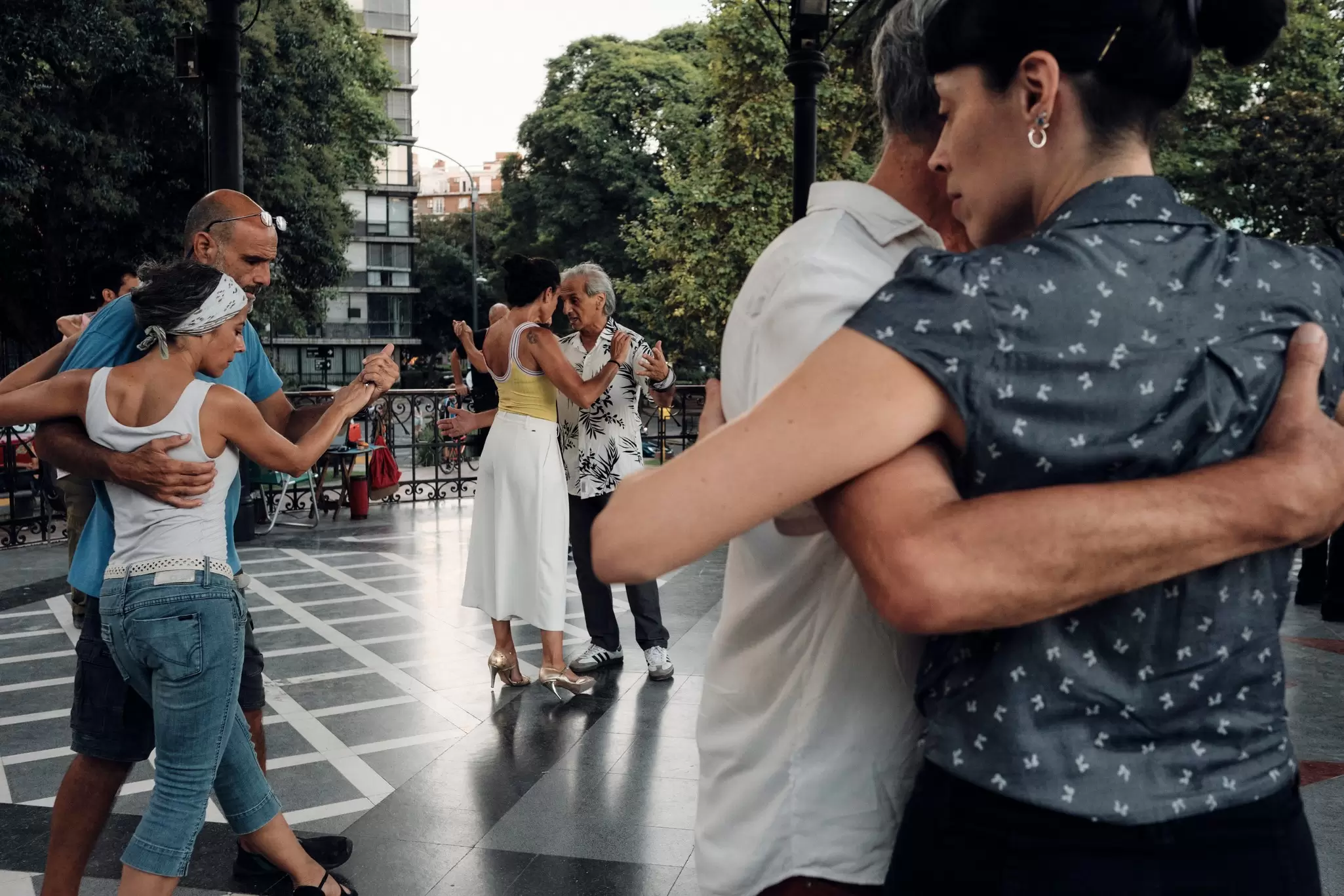 Dancers dance Argentinian tango on the street on a sunday fair in San Telmo old historical neighborhood in the center of Buenos Aires in the evening.