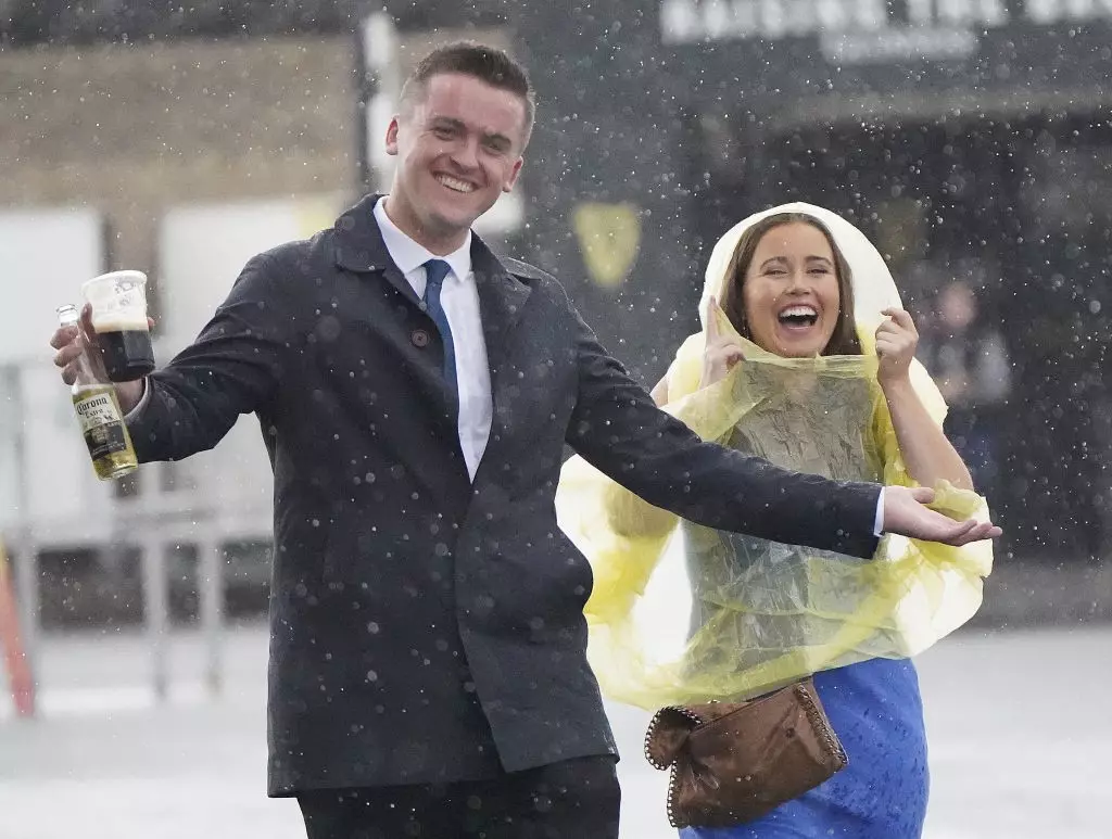 Horseracing fans at a damp Curragh Racecourse, County Kildare © Niall Carson/PA  via Getty Images